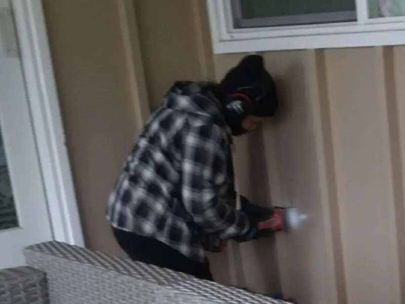 Professional electrician installing an exterior outlet in Statham