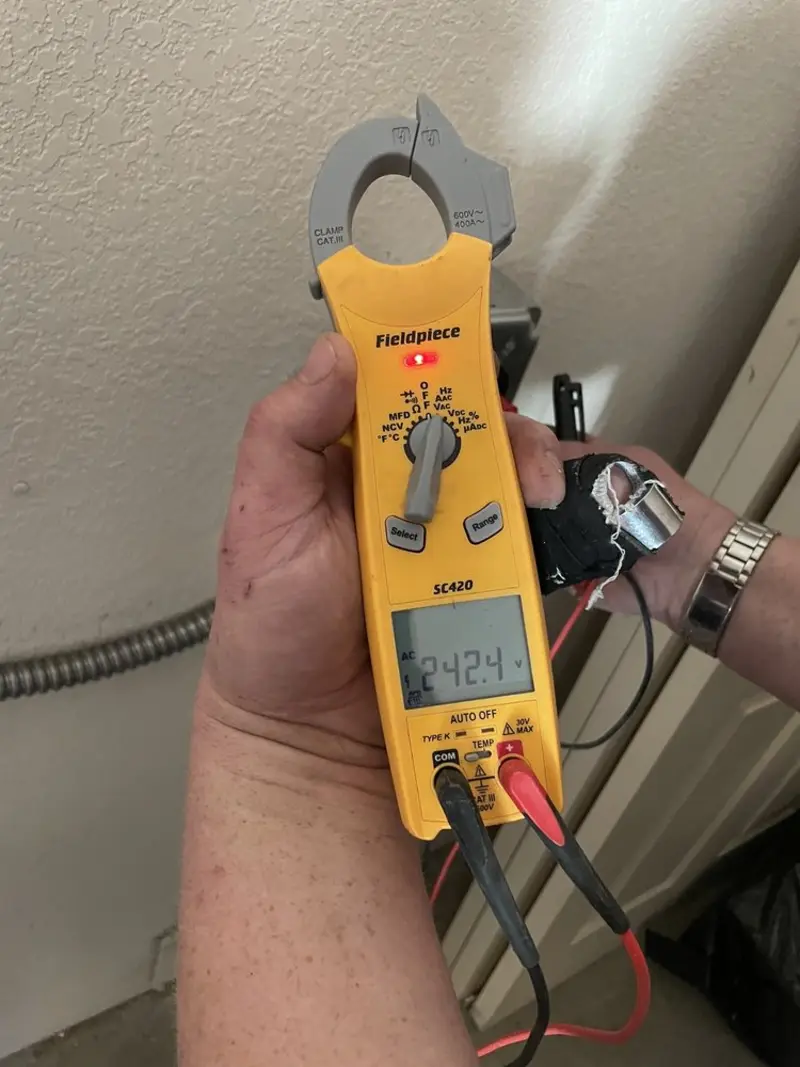 Voltage testing with clamp meter during Whole House Surge Protector in Statham